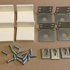 May include: Four white plastic corner brackets and four metal corner brackets with a set of screws.