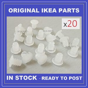 May include: A collection of twenty white IKEA furniture parts. The image includes the text "ORIGINAL IKEA PARTS" and "IN STOCK - READY TO POST". Each part is a small, plastic component with a cylindrical shape.
