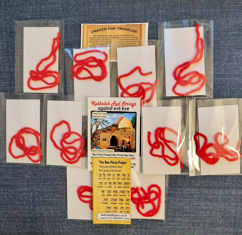 May include: Ten red strings in individual clear plastic bags with white cards. The cards have a prayer written in Hebrew and English. The prayer is called "The Ben Porat Prayer". The prayer is said to prevent the evil eye. The cards also have a picture of a building with a dome on top. The text on the card reads "Kabbalah Red Strings against evil eye".