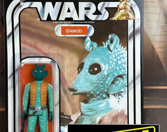 May include: A vintage Star Wars action figure card featuring Greedo, a green alien with a brown vest and a blaster pistol. The card has a black background with white text and a picture of Greedo from the movie. The card also has a sticker on the bottom right corner that says "Stan Solo Creations".