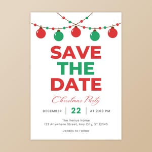 May include: A white Christmas party invitation with red and green text. The text reads "SAVE THE DATE" and details the event for December 22nd at 2:00 PM. The design includes string lights and baubles.