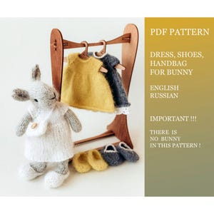 May include: A knitted bunny doll in a white dress with a small handbag. A wooden rack displays miniature dresses and shoes in yellow and grey. The image includes text: "PDF PATTERN, DRESS, SHOES, HANDBAG FOR BUNNY, ENGLISH RUSSIAN, IMPORTANT!!! THERE IS NO BUNNY IN THIS PATTERN!"