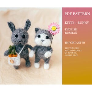 May include: A knitted gray bunny and cat toy pattern. The bunny has long ears and carries a small bag with carrots. The cat holds a pink flower. The pattern is for the Kitty and Bunny toys and is available in English and Russian.