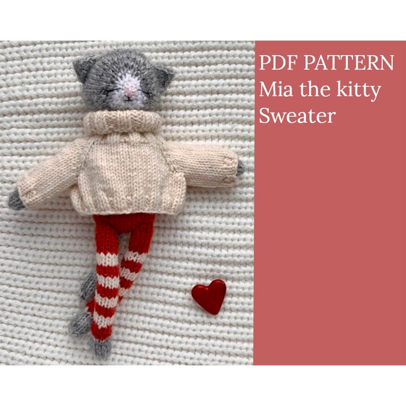 May include: A PDF knitting pattern for a Mia the kitty sweater. The pattern features a gray and white kitty wearing a cream colored sweater and red and white striped pants. A red heart is in the background.