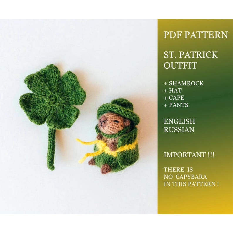 A knitted St. Patrick’s Day outfit set is displayed flat on a white background. The set includes a green hat, cape, pants, and a shamrock accessory. Text on the side explains that this PDF pattern does not include a capybara toy.