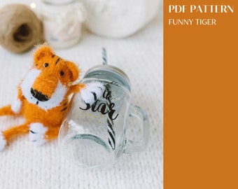 Funny Tiger knitting pattern. Knitted amigurumi tiger step by step tutorial. DIY pocket toy. English and Russian PDF.