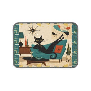 May include: A rectangular mat featuring a black cat lounging on a teal sofa. The scene includes a starburst clock, a martini glass on a coffee table, a potted plant, and a lamp. The border has a repeating pattern of teal and white rounded rectangles.