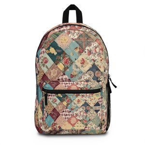 May include: A patchwork style backpack with a floral pattern in shades of blue, pink, red, and green. The backpack has a zippered pocket on the front and a mesh pocket on the side.