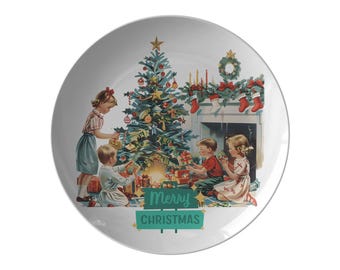 May include: A vintage Christmas scene with three children opening presents under a decorated Christmas tree. The scene is framed by a fireplace with stockings hanging from the mantle. The text "Merry Christmas" is written on a green sign in the foreground.