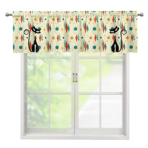 May include: A cream-colored valance with a retro atomic design featuring black cat silhouettes and colorful diamond and starburst patterns. The valance is mounted above a white window.