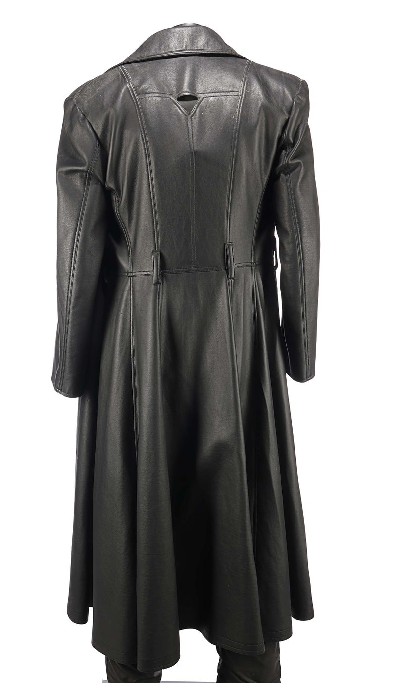 May include: A long black leather coat with a fitted waist and a flared skirt. The coat has a high collar and a button closure.