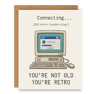 May include: A greeting card featuring a beige vintage computer with a screen displaying an AOL connecting window, the text Connecting... [EEE-Krrrr-Ssshhh-Ding!] at the top, and the text YOU'RE NOT OLD YOU'RE RETRO at the bottom.