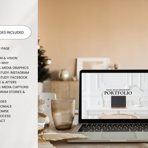 May include: A laptop computer displaying a website with the text "SOCIAL MEDIA MANAGEMENT PORTFOLIO". The laptop is on a table with a glass of water and a decorative plant.