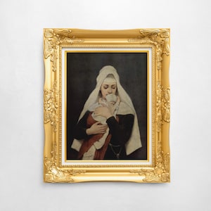 May include: A framed painting of a woman in a white veil holding a baby, set against a dark background. The woman wears a black dress and a red garment. The ornate gold frame adds a classic touch to the artwork.