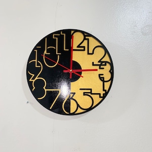 Opposites Wall Clock