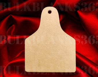 May include: A brown wooden tag shape with a hole at the top. The tag is on a red satin fabric background.