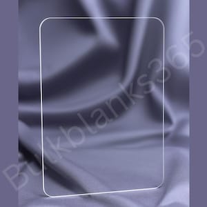 May include: A clear, rectangular glass panel with rounded corners, set against a backdrop of draped, dark gray fabric. The panel is outlined with a thin white border, creating a clean, modern aesthetic. The image is framed by a muted purple border.