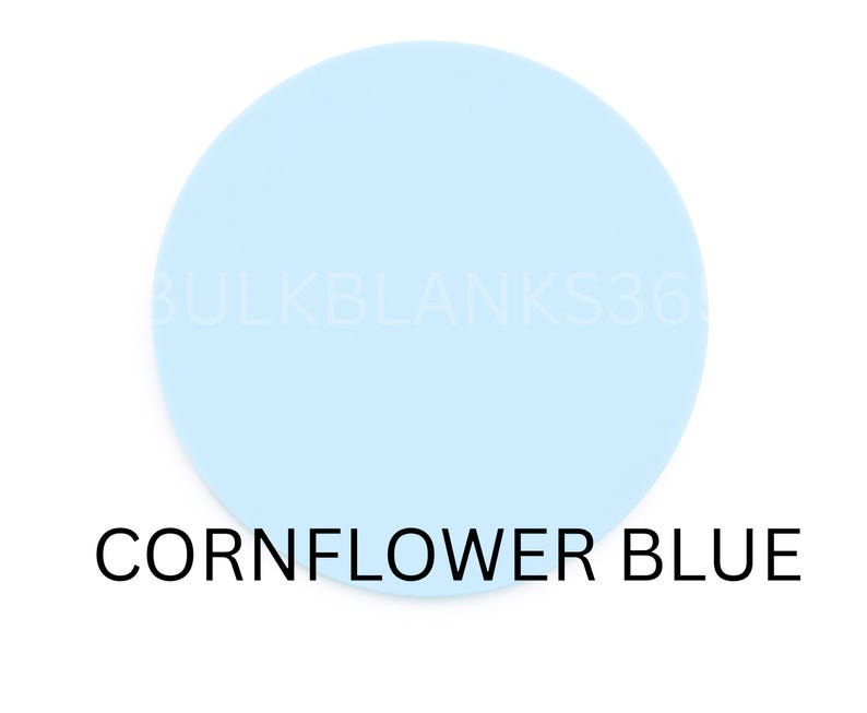 May include: A round, cornflower blue object against a white background. The text "CORNFLOWER BLUE" is displayed in black below the object. The object has the text "BULKBLANKS36" in a faded white color.