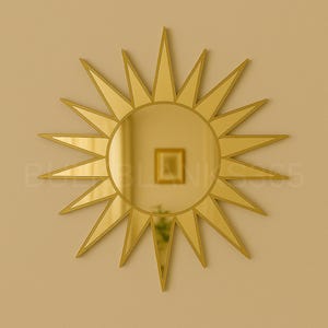May include: A gold-colored sunburst mirror with a circular center and pointed rays. The mirror is mounted on a light-colored wall. The mirror reflects a room with a framed picture.
