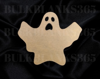 May include: A beige wooden ghost cutout with a black face and two black eyes. The ghost is on a black fabric background.