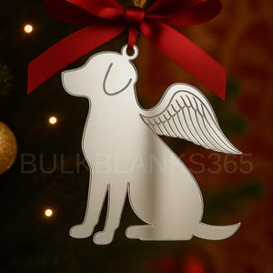 May include: A silver-colored dog ornament with angel wings, hanging from a red ribbon. The dog is in a sitting position. The text "BULKBLANKS365" is visible on the ornament. The background is a blurred Christmas tree.