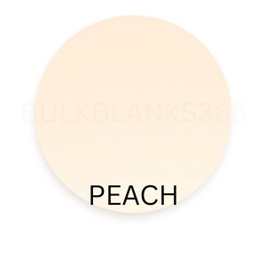 May include: A round, peach-colored blank product with the word "PEACH" in black, sans-serif font at the bottom. The product is set against a white background. The watermark "BULKBLANKS365" is faintly visible.