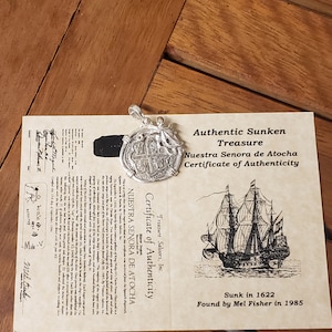 Auténtica réplica de moneda de naufragio de Atocha con pulpo en bisel y con COA