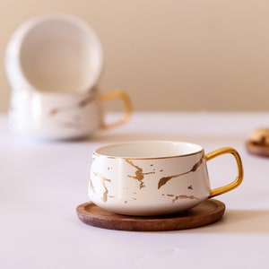 Coffee, Tea Cup with Wooden Saucer. Handle Painted with Gold liquid.