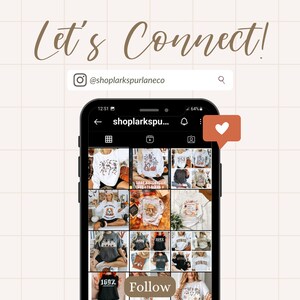 May include: A screenshot of a mobile phone displaying an Instagram profile page for "shoplarkspurlaneco". The profile features a grid of images of sweatshirts with various autumnal and Halloween-themed designs. The caption reads "Let's Connect!" and includes a heart icon and a "Follow" button.
