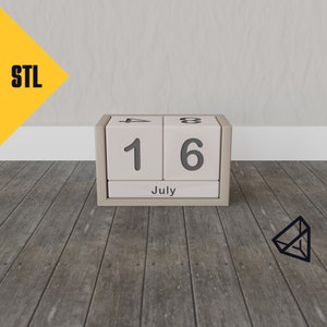 Op de afbeelding: Een houten blokkenkalender met de datum 16 juli. De kalender staat op een houten oppervlak.