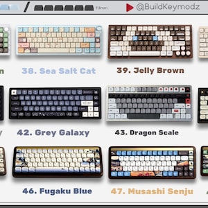 May include: A collection of twelve mechanical keyboards arranged in a grid, labeled 37 through 48. Each keyboard features unique color schemes and keycap designs, including themes like Green Brown, Sea Salt Cat, Jelly Brown, Little Dog, White Galaxy, Grey Galaxy, Dragon Scale, Beige Brown, Fugaku, Fugaku Blue, Musashi Senju, and Mount Fuji.