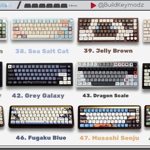 May include: A collection of twelve mechanical keyboards arranged in a grid, each featuring distinct color schemes and keycap designs labeled from 37 to 48, including Green Brown, Sea Salt Cat, Jelly Brown, Little Dog, White Galaxy, Grey Galaxy, Dragon Scale, Beige Brown, Fugaku, Fugaku Blue, Musashi Senju, and Mount Fuji.
