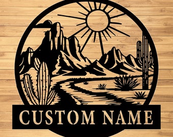 May include: Black metal silhouette of a desert landscape with mountains, a sun, cacti, and a winding path. The text "CUSTOM NAME" is displayed below the image.
