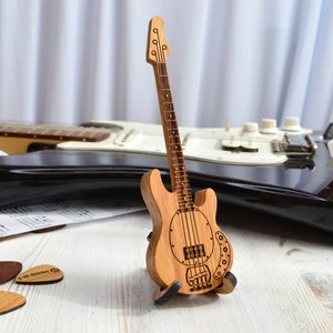 wooden bass guitar shaped box for pick on stand