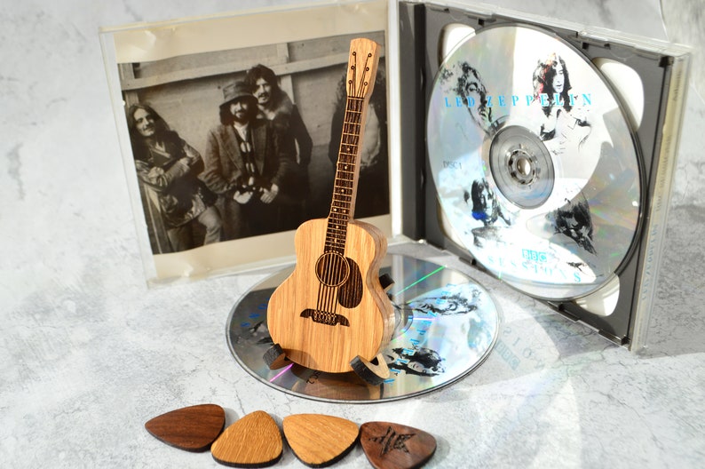 wooden mini guitar on stand - souvenir for guitarist