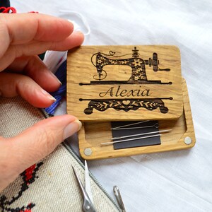 wooden box for needles, on the lid engraved sewing machin and name