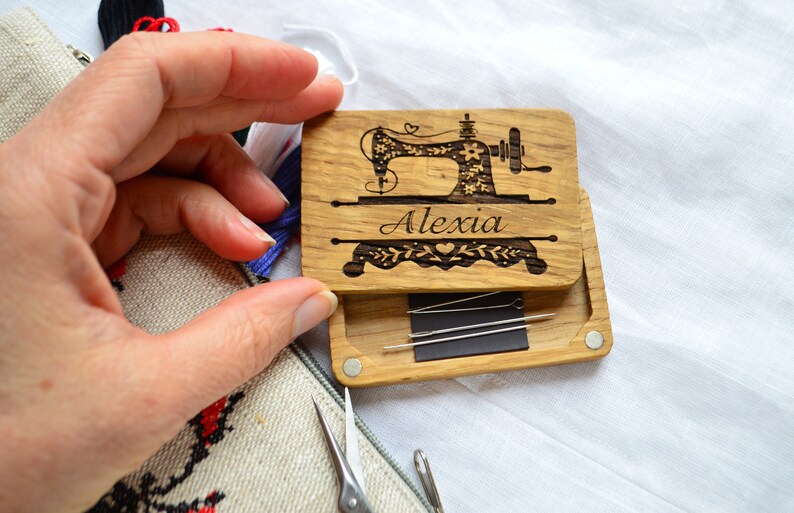 wooden box for needles, on the lid engraved sewing machin and name