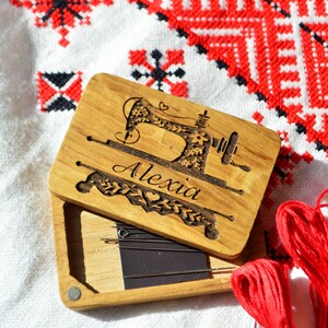 wooden box for needles with magnet band, lid of the box held on magnets, on the lid engraved picture and name