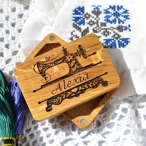 wooden box for needles with magnet band, lid of the box held on magnets, on the lid engraved picture and name
