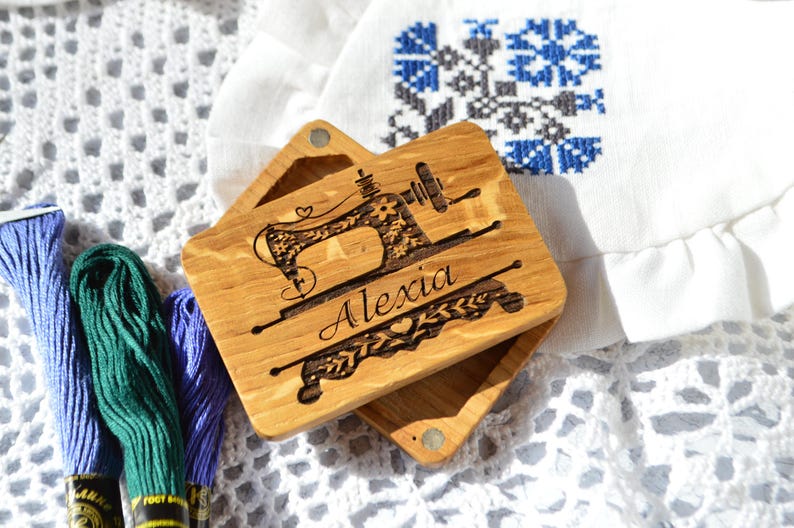 wooden box for needles with magnet band, lid of the box held on magnets, on the lid engraved picture and name