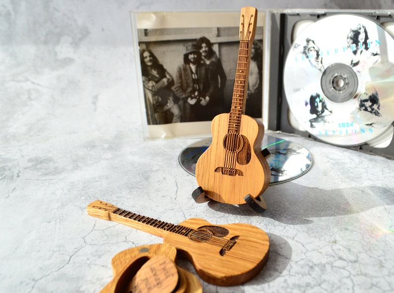 wooden mini guitar on stand - souvenir for guitarist
