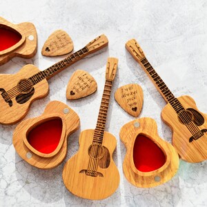 wooden boxes in acoustic guitar form with wooden engraved guitar picks