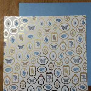 12 x 12 assorted images in gold frame cardstock sheets, w/ complementary blue card stock sheets