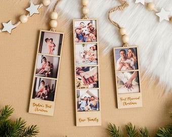 May include: Wooden photo ornaments with family photos. Each ornament has a rectangular frame with multiple photos and a wooden bead and star garland. One ornament says "Sophia's First Christmas", another says "Our Family", and the last says "First Married Christmas".