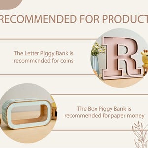 May include: Two wooden piggy banks. The first is a letter R piggy bank, painted pink with a black outline. The second is a rectangular box piggy bank with a light blue interior. The text "The Letter Piggy Bank is recommended for coins" and "The Box Piggy Bank is recommended for paper money" is displayed below each piggy bank.