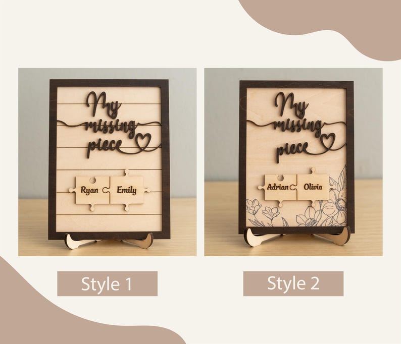 May include: Two wooden signs with the text "My missing piece" and a heart symbol. The signs have two puzzle pieces with names on them. The first sign has the names "Ryan" and "Emily" and the second sign has the names "Adrian" and "Olivia". The signs are on a wooden stand.