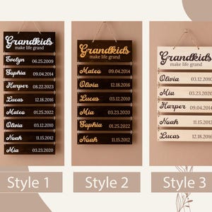 May include: Three rectangular wooden wall signs with hanging twine, each featuring the text Grandkids make life grand and multiple horizontal slats engraved with names and dates. The signs vary in wood finish, including dark and light tones.