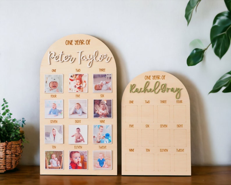 May include: Two wooden photo display boards with arched tops. The boards are decorated with the words "One Year of" and the names "Peter Taylor" and "Rachel Gray". Each board has 12 squares for photos, numbered one through twelve.
