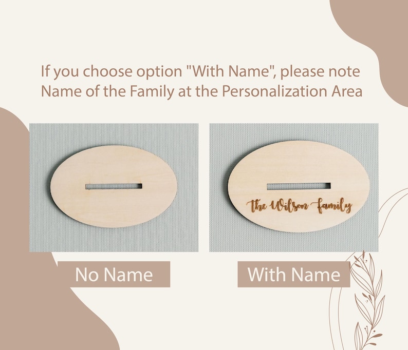 May include: Two oval wooden signs, one with the text "The Wilson family" engraved on it and the other with a blank space for personalization. The signs are on a light gray background.