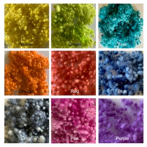 May include: Nine samples of wool roving in different colours: yellow, green, teal, orange, red, blue, grey, pink, and purple.